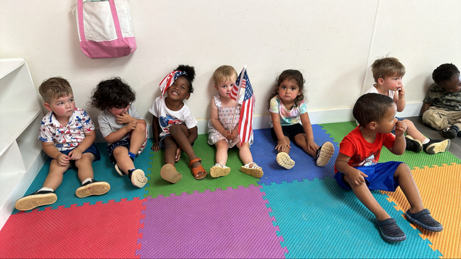 Children celebrating July 4th at Sunshine Daycare